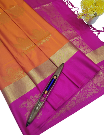 Radiant Glow – Orange Semi Soft Silk Saree with Pink Contrast & Zari Border
