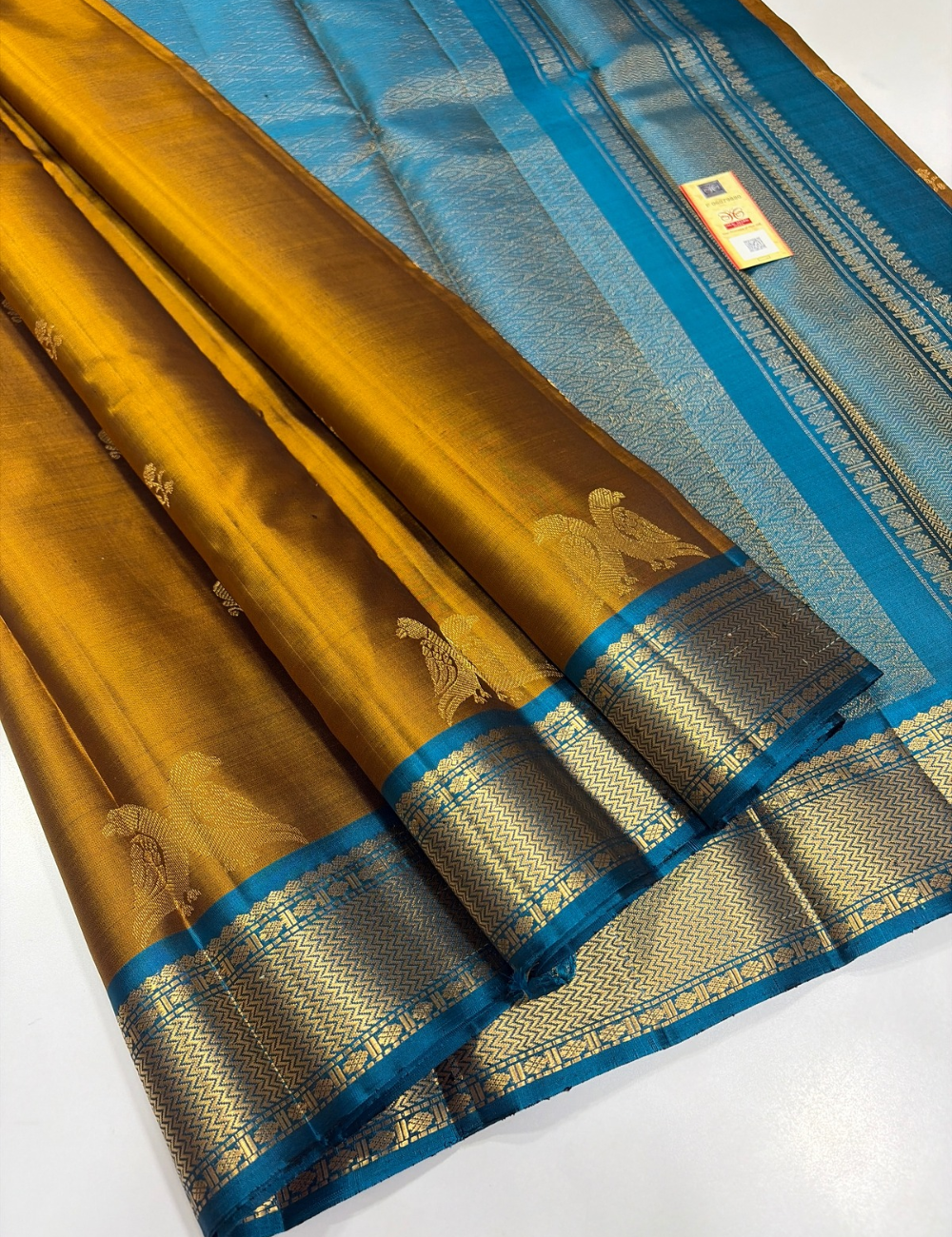 Mustard Yellow Kanchipuram Silk Saree with Ferozi Blue Kanchi Border & Traditional Gold Zari Puttas