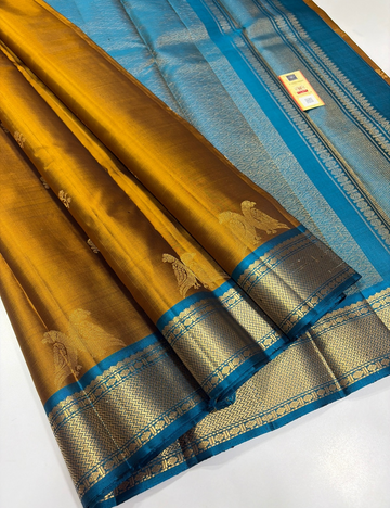 Mustard Yellow Kanchipuram Silk Saree with Ferozi Blue Kanchi Border & Traditional Gold Zari Puttas