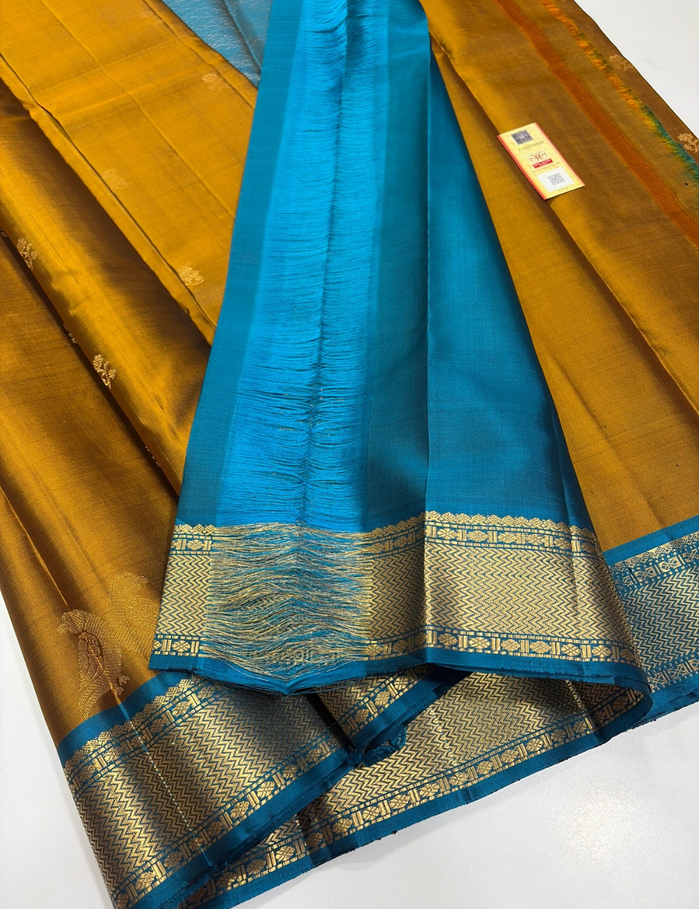 Mustard Yellow Kanchipuram Silk Saree with Ferozi Blue Kanchi Border & Traditional Gold Zari Puttas