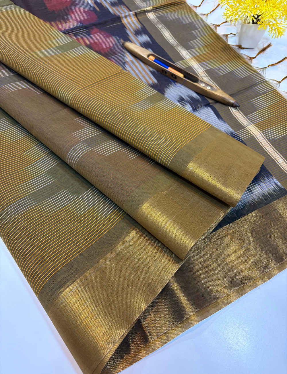 Semi Silk Cotton Ikat Design Tissue Border Saree – Olive Brown with Gold Tissue Border