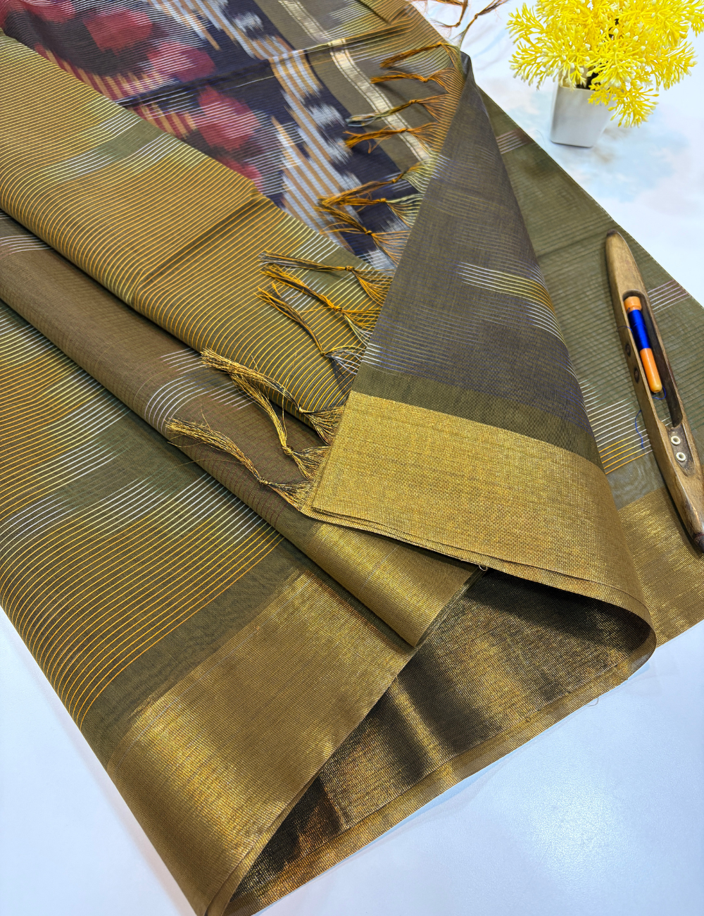 Semi Silk Cotton Ikat Design Tissue Border Saree – Olive Brown with Gold Tissue Border