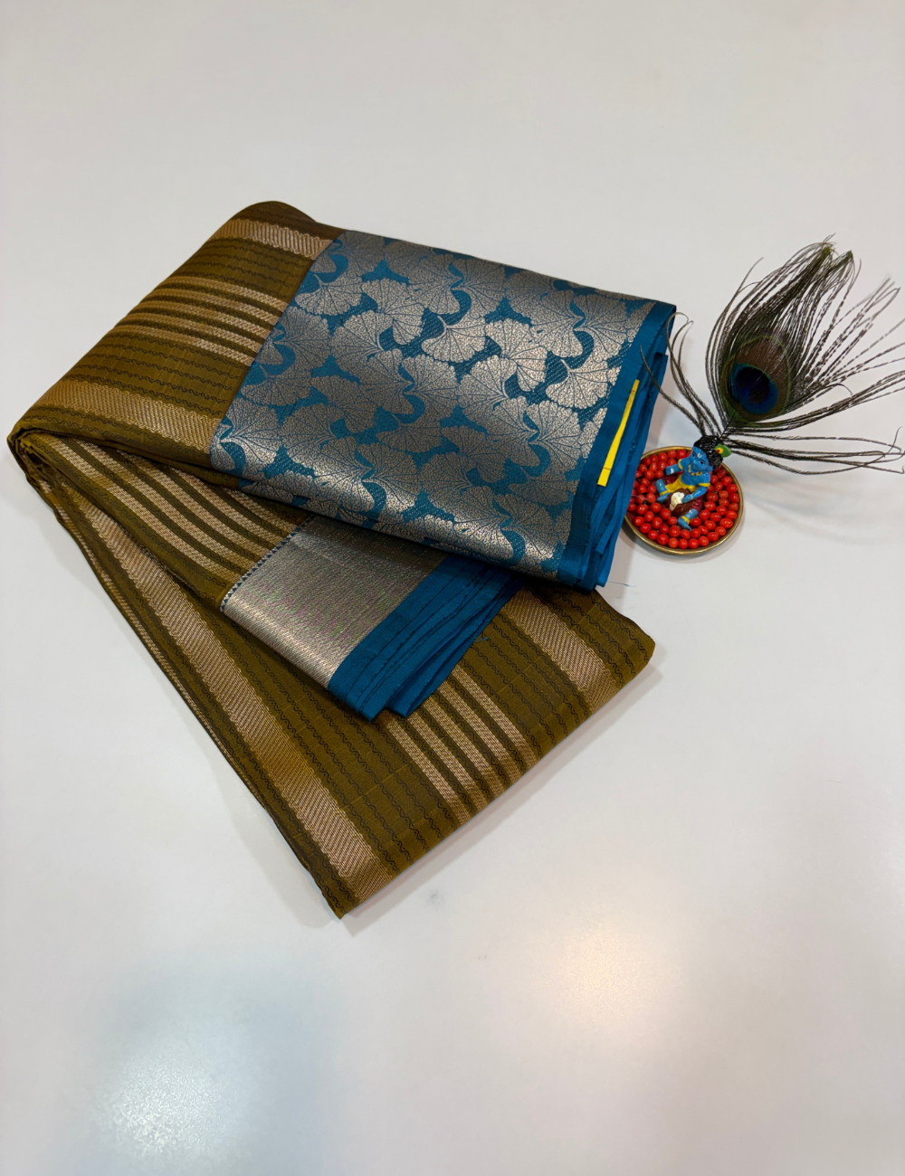 50% Pure Mix Silk Saree – Olive Mustard with Peacock Blue Contrast Pallu & Antique Gold Brocade Border | Emboss Design Body