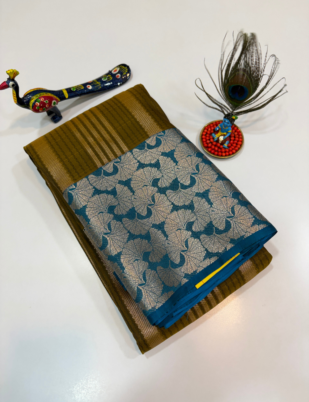50% Pure Mix Silk Saree – Olive Mustard with Peacock Blue Contrast Pallu & Antique Gold Brocade Border | Emboss Design Body