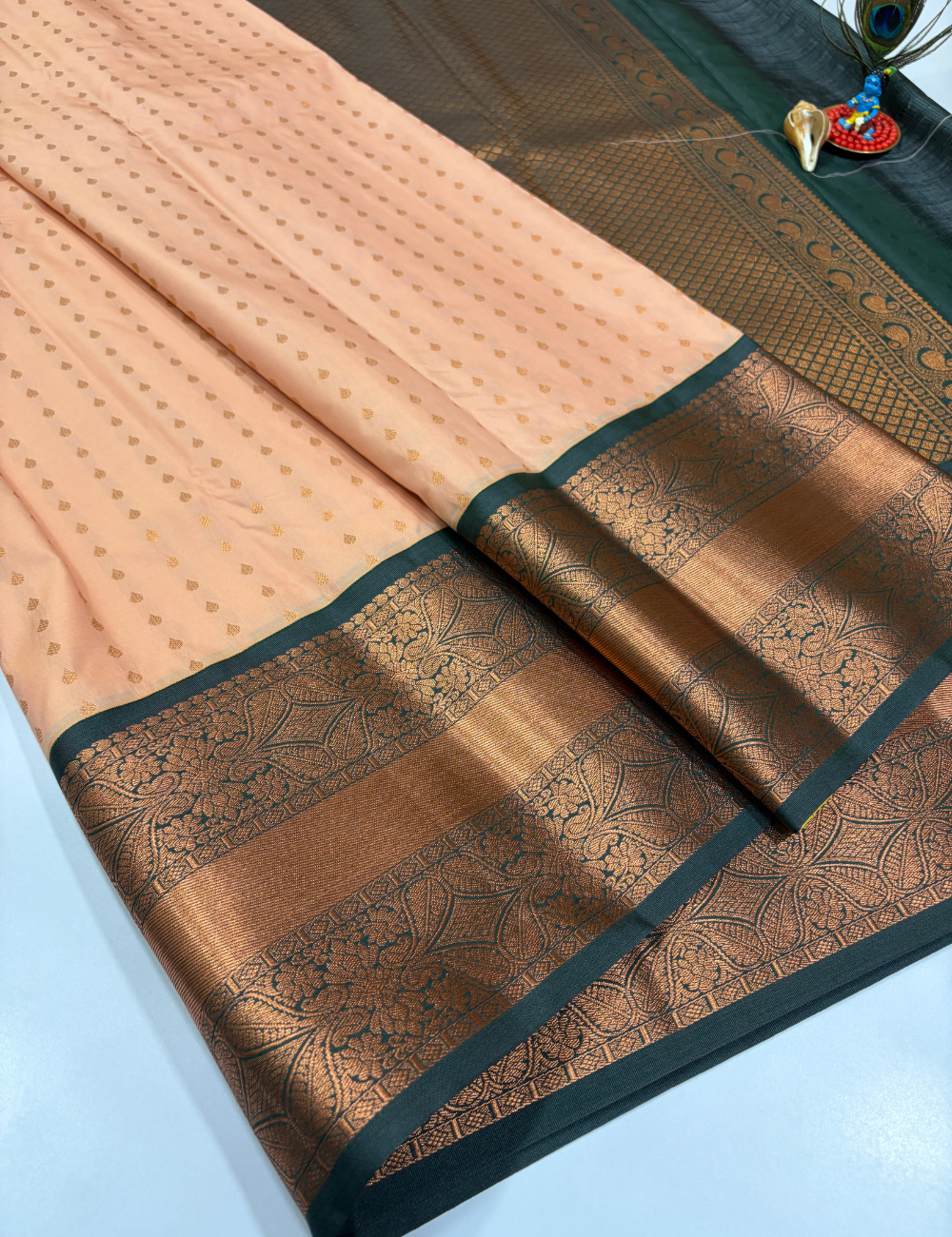 Peach Semi Soft Silk Saree with Bottle Green Pallu & 1000 Butta Design Rich Kanchi Border