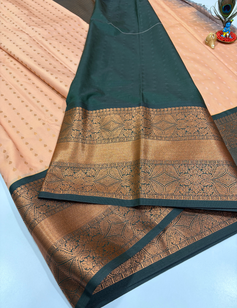 Peach Semi Soft Silk Saree with Bottle Green Pallu & 1000 Butta Design Rich Kanchi Border