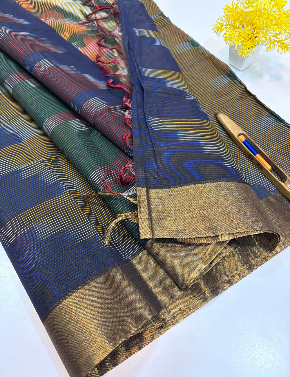Semi Silk Cotton Ikat Design Tissue Border Saree – Navy Blue with Gold Tissue Border